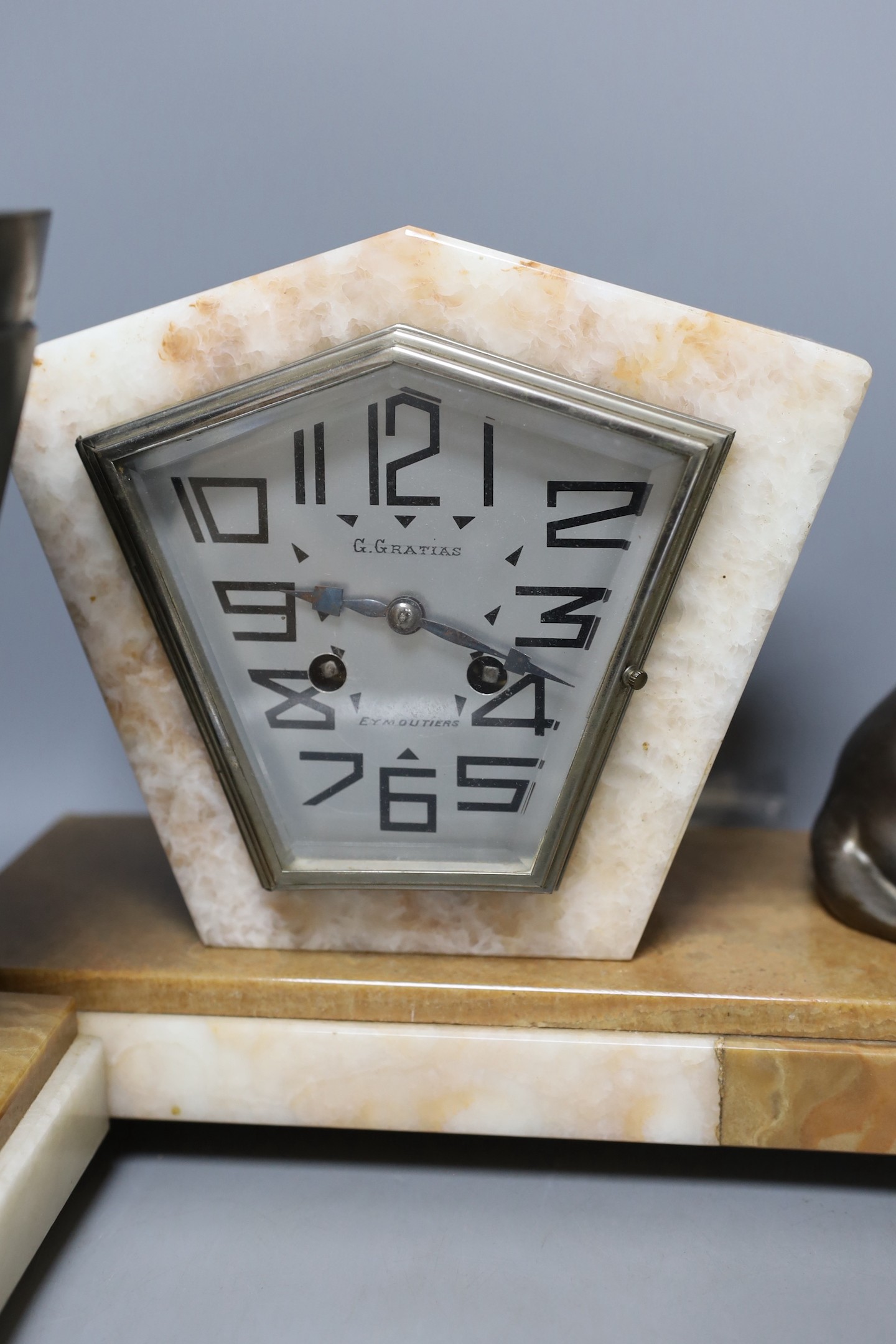 An Art Deco marble and spelter panther clock garniture